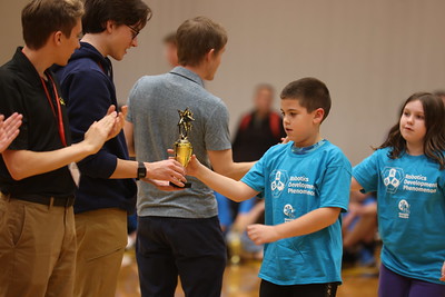 a group of students standing in line for awards