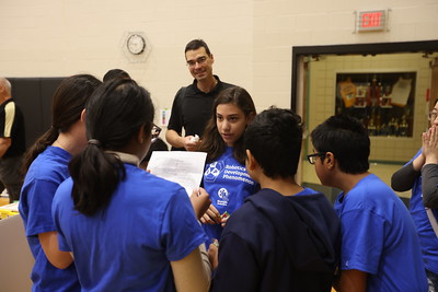 a group of students talking in a circle