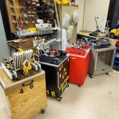 4 FIRST Tech Challenge robots sitting on carts