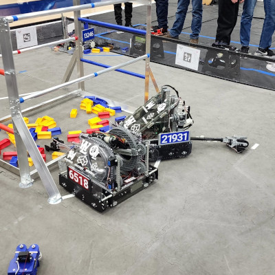 2 of our FIRST Tech Challenge robots sitting on the competition field